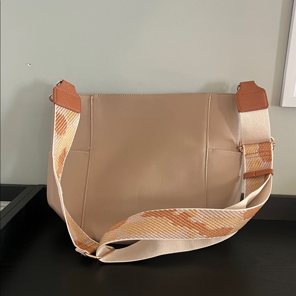 Ah-dorne cross body bag with three outside pockets. EUC Tan with Patterned Strap